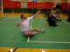 John, one of my fellow volunteers, throws up a serve during  our game.